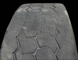 (SECTION 1: Irregular drive tire conditions) 3. Brake Skid Damage Appearance: Localized spot of excessive wear across tread face showing abrasion marks. Damage may extend into casing. Probable Cause: New brakes (not worn in), unbalanced brake system, frozen brake lines, driver abuse. Corrective Action: Check brake system. Tire Disposition: May be repaired or retreaded if casing is undamaged; otherwise, scrap. (SECTION 1: Irregular drive tire conditions) 3. Brake Skid Damage Appearance: Localized spot of excessive wear across tread face showing abrasion marks. Damage may extend into casing. Probable Cause: New brakes (not worn in), unbalanced brake system, frozen brake lines, driver abuse. Corrective Action: Check brake system. Tire Disposition: May be repaired or retreaded if casing is undamaged; otherwise, scrap.