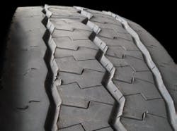 (SECTION 3: Irregular steer tire conditions) 6. Radial Feather Wear Appearance Feathering at the edge of the tread ribs. Probable Cause: Usually the result of continued exposure to lateral force, such as excessive toe. Can also form as a result of counter-steering to compensate for drive axle misalignment. Corrective Action: Check alignment. Tire Disposition: Rotate to another position or retread. (SECTION 3: Irregular steer tire conditions) 6. Radial Feather Wear Appearance Feathering at the edge of the tread ribs. Probable Cause: Usually the result of continued exposure to lateral force, such as excessive toe. Can also form as a result of counter-steering to compensate for drive axle misalignment. Corrective Action: Check alignment. Tire Disposition: Rotate to another position or retread.