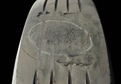 (SECTION 2: Irregular trailer tire conditions) 3. Brake Skid Damage Appearance: Localized spot of excessive wear across tread face showing abrasion marks. Damage may extend into casing. Probable Cause: New brakes (not worn in), unbalanced brake system, frozen brake lines, driver abuse. Corrective Action: Check brake system. Tire Disposition: May be repaired or retreaded if casing is undamaged; otherwise, scrap. (SECTION 2: Irregular trailer tire conditions) 3. Brake Skid Damage Appearance: Localized spot of excessive wear across tread face showing abrasion marks. Damage may extend into casing. Probable Cause: New brakes (not worn in), unbalanced brake system, frozen brake lines, driver abuse. Corrective Action: Check brake system. Tire Disposition: May be repaired or retreaded if casing is undamaged; otherwise, scrap.