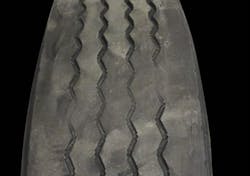 (SECTION 2: Irregular trailer tire conditions) 2. Diagonal Wear Appearance: Localized flat spots worn diagonally across the tread, often repeating around the tire. Probable Cause: Improper bearing adjustment, misalignment, mismatched dual tire diameter and/or inflation pressure. May start as brake skid. Aggravated by high speed/light loads. Corrective Action: Analyze cause and correct. Tire Disposition: Reverse direction of rotation. If excessive, submit for retreading. (SECTION 2: Irregular trailer tire conditions) 2. Diagonal Wear Appearance: Localized flat spots worn diagonally across the tread, often repeating around the tire. Probable Cause: Improper bearing adjustment, misalignment, mismatched dual tire diameter and/or inflation pressure. May start as brake skid. Aggravated by high speed/light loads. Corrective Action: Analyze cause and correct. Tire Disposition: Reverse direction of rotation. If excessive, submit for retreading.