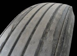 (SECTION 2: Irregular trailer tire conditions) 5. Shoulder Step Wear Appearance: Tire worn on edge of one shoulder, greater than 12” in circumference. Probable Cause: Excessive camber, misaligned or damaged axle, improper bearing adjustment. Corrective Action: Diagnose misalignment and/ or mechanical condition and correct. Tire Disposition: Reverse direction of rotation. If excessive, submit for retreading. (SECTION 2: Irregular trailer tire conditions) 5. Shoulder Step Wear Appearance: Tire worn on edge of one shoulder, greater than 12” in circumference. Probable Cause: Excessive camber, misaligned or damaged axle, improper bearing adjustment. Corrective Action: Diagnose misalignment and/ or mechanical condition and correct. Tire Disposition: Reverse direction of rotation. If excessive, submit for retreading.