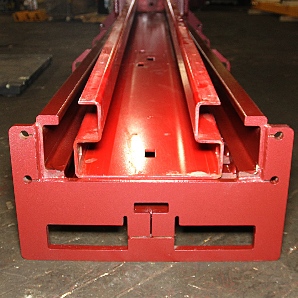 Higher quality lifts typically use heavy welded steel channels (lower) whereas less expensive lifts are made of lighter sheet metal (upper).