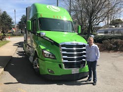 Standing in front of the retrofit Hyllion hybrid-electric Class 8 tractor, during a press event in Atlanta. Standing in front of the retrofit Hyllion hybrid-electric Class 8 tractor, during a press event in Atlanta.