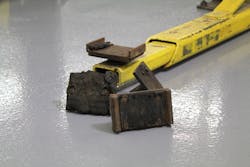 To improve bay safety, technicians should get to know their lifts by truly paying attention to potential safety hazards or damage to the lift and its accessories. For example, it is important to check lift contact points such as lifting pads to make sure they are free of debris, grease, oil, and anything else that may prevent solid contact. Adapters in the condition shown here should not be used. To improve bay safety, technicians should get to know their lifts by truly paying attention to potential safety hazards or damage to the lift and its accessories. For example, it is important to check lift contact points such as lifting pads to make sure they are free of debris, grease, oil, and anything else that may prevent solid contact. Adapters in the condition shown here should not be used.