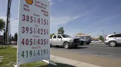 This April 23 file photo shows gas prices displayed at a Shell station in Sacramento, California. Four major automakers have reached a secret deal with California to increase gas mileage and greenhouse gas emissions standards, bypassing the Trump administration’s plan to freeze standards at 2021 levels, according to two people briefed on the matter.