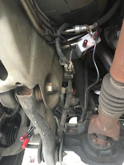 Be sure to place the transmitter and microphone wire in a location away from moving parts and hot exhaust components. Be sure to place the transmitter and microphone wire in a location away from moving parts and hot exhaust components.