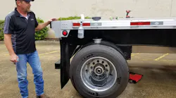 A Velociti representative demonstrates how quickly the MTIS can be retrofitted onto a trailer.