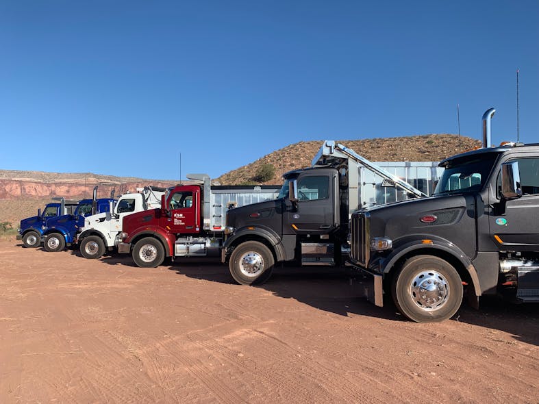 The lineup included 2020 Peterbilt Model 567s, some specified with traditional dump bodies, side dumps, and tractors designed for heavy haul.