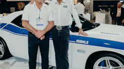 Grand Prize winner Jim Pickles and 'The King' Richard Petty aside Pickles' supercharged Dodge Challenger at MAHLE's booth at AAPEX.