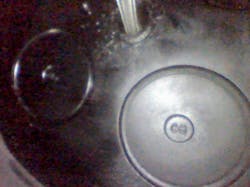 In this image, a technician is looking up at the valves in a diesel engine using a Vividia D3145 articulating camera. In this image, a technician is looking up at the valves in a diesel engine using a Vividia D3145 articulating camera.