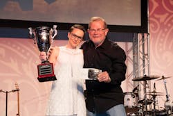Rebecca Chewning receiving her trophy for All-Around Grand Champion of the Hino parts division from 'Rusty' Rush. Rebecca Chewning receiving her trophy for All-Around Grand Champion of the Hino parts division from 'Rusty' Rush.