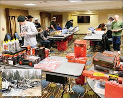 The technicians receiving their new tools through Professional Tool & Equipment News and VehicleServicePros.com's Holiday Tool Drive. The inset shows the shop after the fire. The technicians receiving their new tools through Professional Tool & Equipment News and VehicleServicePros.com's Holiday Tool Drive. The inset shows the shop after the fire.