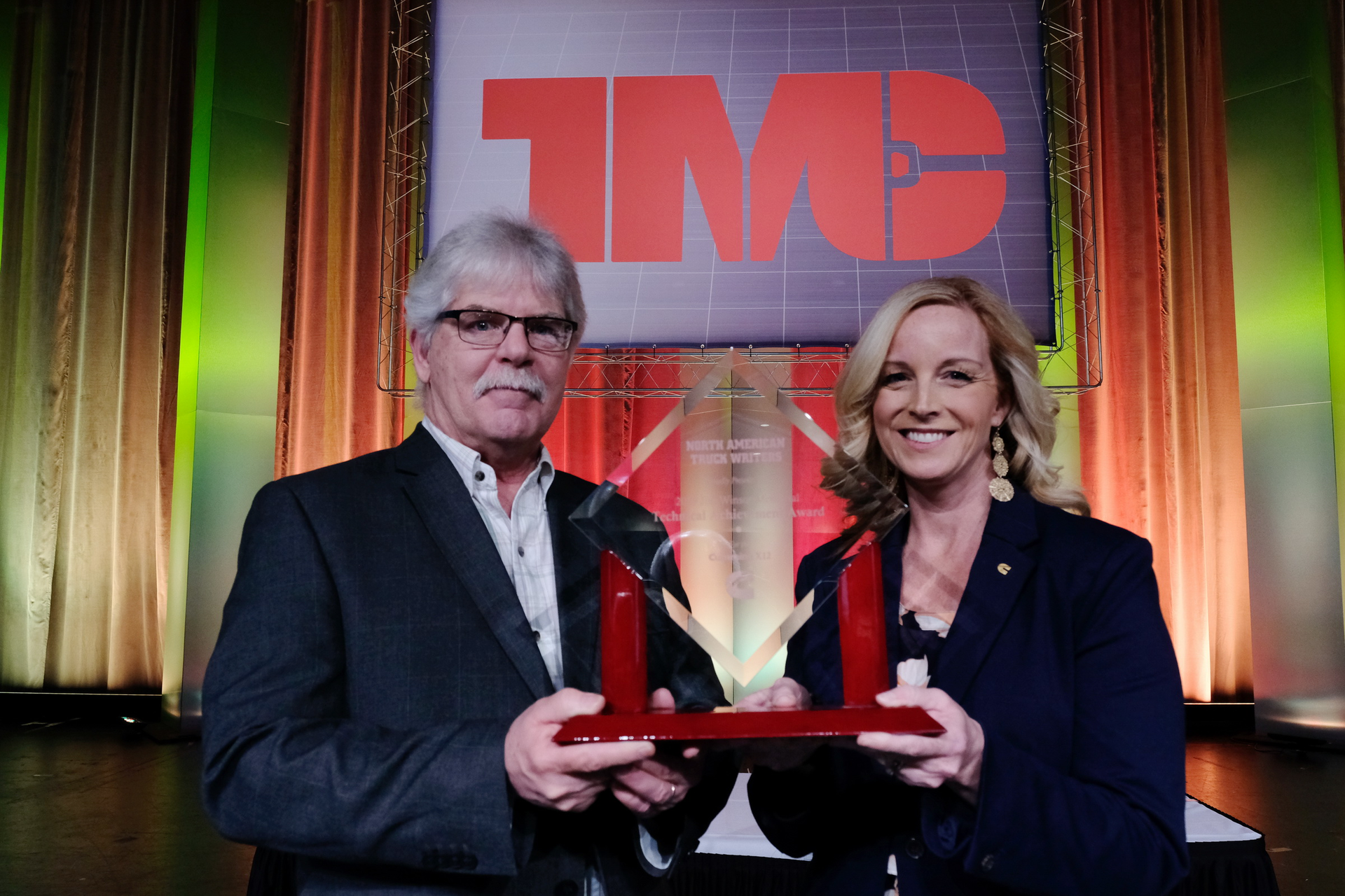 Krista Toenjes of Cummins (right) accepts the 2019 Jim Winsor Technical Achievement award from award committee chair, Jim Park, at last year's TMC awards luncheon. The 2020 Jim Winsor award will be presented at TMC on February 26.