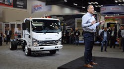 Shaun Skinner, president of Isuzu Commercial Truck of America, and president of Isuzu Commercial Truck of Canada stands in front of the Isuzu NPR-HD truck, during a press conference at the Work Truck Show 2020.