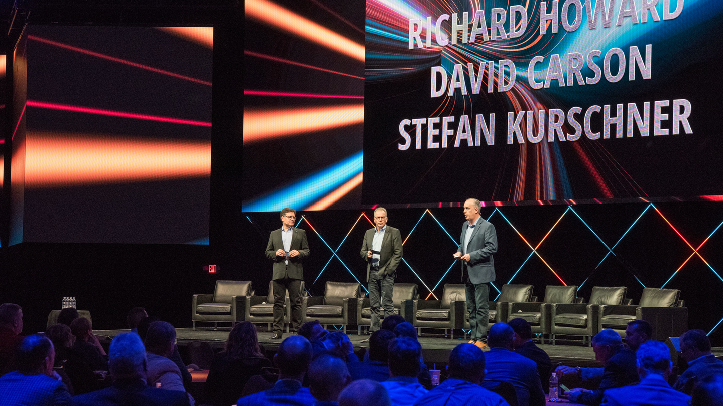 From left to right, Richard Howard, Stefan Kurschner and David Carson, discuss DTNA's new market strategy on stage.