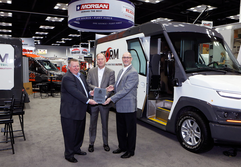 Morgan Olson's Rich Tremmel, vice president of sales and marketing, and Mark Hope, vice president of engineering, receive The Work Truck Show 2020 Innovation Award, body concept category, for the company's Class 2 Storm step van, from NTEA President and CEO Steve Carey.