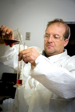 Kevin Adams, vice president of research and development, LSI Chemical, tests a new LSI Chemical oil additive. Kevin Adams, vice president of research and development, LSI Chemical, tests a new LSI Chemical oil additive.