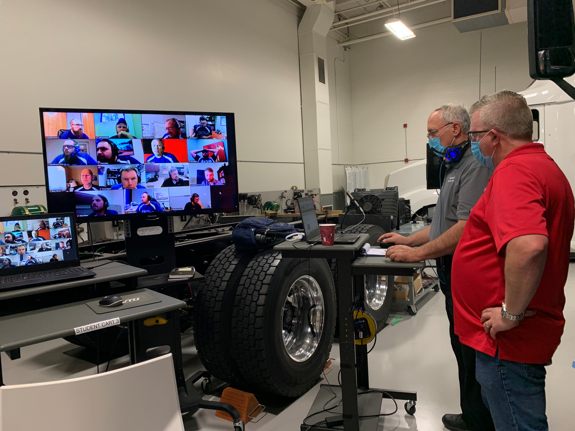 DTNA Technician Skills Competition judges collaborating online with participants.