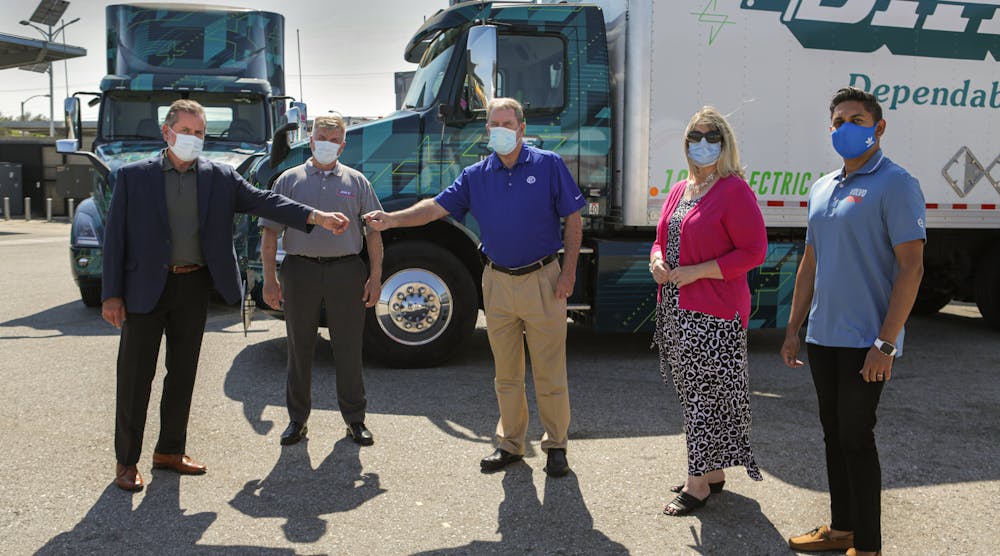 General Manager of Volvo Trucks North America&rsquo;s TEC Equipment dealership, Mike Reardon, hands over the keys to the first Volvo VNR Electric Class 8 truck models to Joe Finney with Dependable Highway Express. From left to right: Joe Finney, chief operating officer, Dependable Highway Express; Troy Musgrave, director of process improvement, Dependable Highway Express; Mike Reardon, general manager, TEC Equipment; Janice Rutherford, County Supervisor, San Bernardino County and South Coast Air Quality Management District board member; Aravind Kailas, advanced technology policy director, Volvo Group North America.