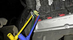 Fig. 3 - The PCM was located within the left-front fender well of the vehicle (shown here). Fig. 3 - The PCM was located within the left-front fender well of the vehicle (shown here).