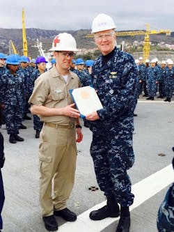 Former Medical Services Officer Jason Williams receiving an award from Vice Adm. Jamie Foggo, who many years ago captained the USS Oklahoma City, on which Fleet Maintenance Editor John Hitch was a sonar technician.