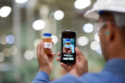 A Mobil engineer using the Mobil Serv Lube analysis scanner to test fluid quality. A Mobil engineer using the Mobil Serv Lube analysis scanner to test fluid quality.
