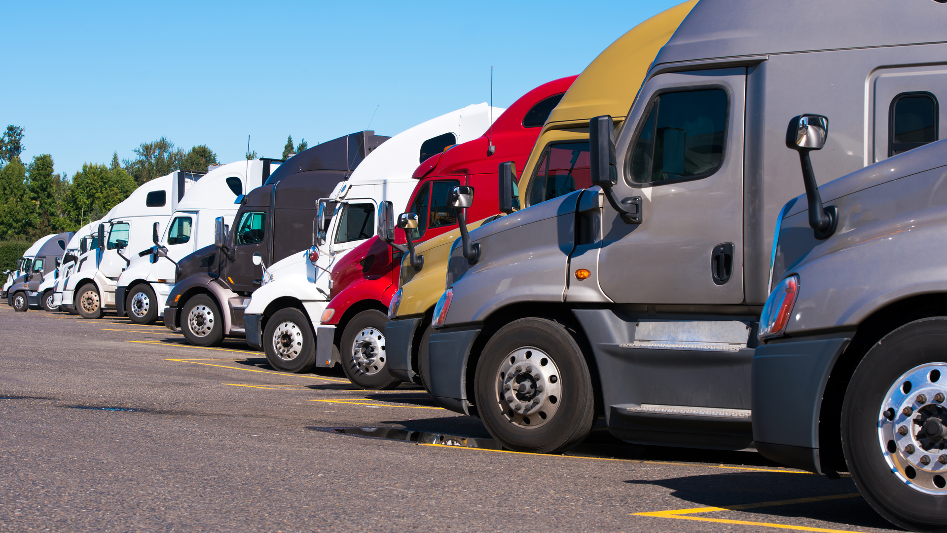 Dreamstime Xxl 104037044 Vitpho Trucks Lined Up 61ae0664a53a3 61af851b4da79