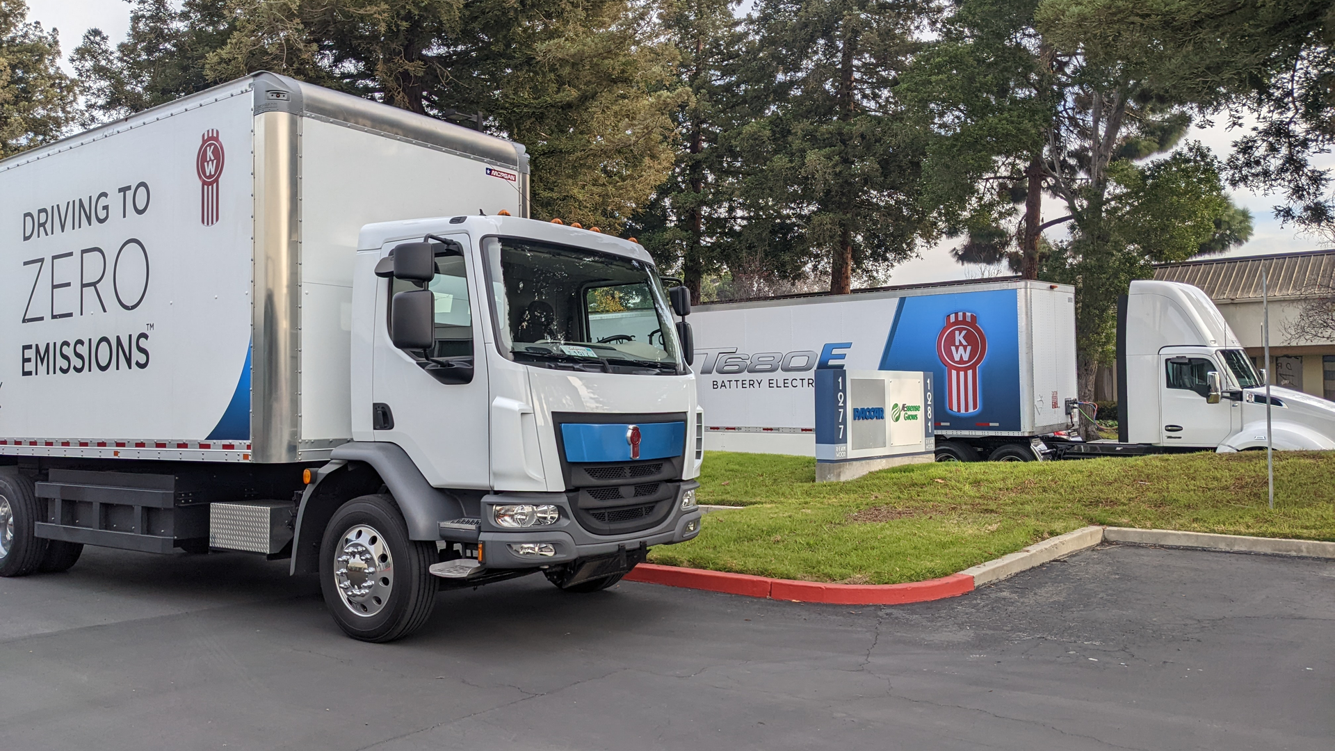 Kenworth shows off its medium-duty K270/K370E, left, and heavy-duty T680E, which are available for order.