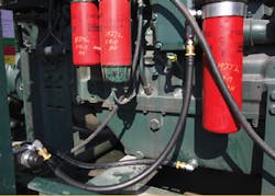 Pictured is an installed QuickFit Oil Change System from Parker Hannifin, which provides a single access point for oil changes. Pictured is an installed QuickFit Oil Change System from Parker Hannifin, which provides a single access point for oil changes.