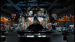 A worker on the line at Ford's Claycomo, Missouri, assembly plant helping to build the E-Transit, the all-electric version of the car and truck maker's popular cargo van. A worker on the line at Ford's Claycomo, Missouri, assembly plant helping to build the E-Transit, the all-electric version of the car and truck maker's popular cargo van.