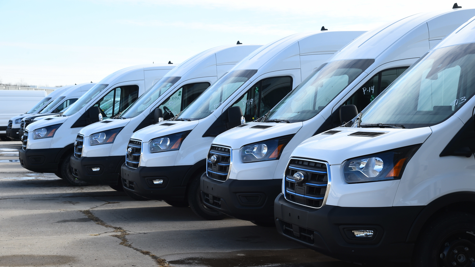 Ford E-Transits outside the Kansas City-area manufacturing plant.