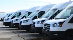 Ford E-Transits outside the Kansas City-area manufacturing plant.
