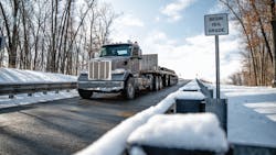 A Peterbilt 567 hauling 140,000 lb. and equipped with the new TX-18 Pro transmission heads downhill on a 15% grade at the Eaton proving grounds. A Peterbilt 567 hauling 140,000 lb. and equipped with the new TX-18 Pro transmission heads downhill on a 15% grade at the Eaton proving grounds.