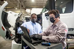 Willie Reeves, PacLease director of maintenance, assists a technician in running diagnostics. Willie Reeves, PacLease director of maintenance, assists a technician in running diagnostics.