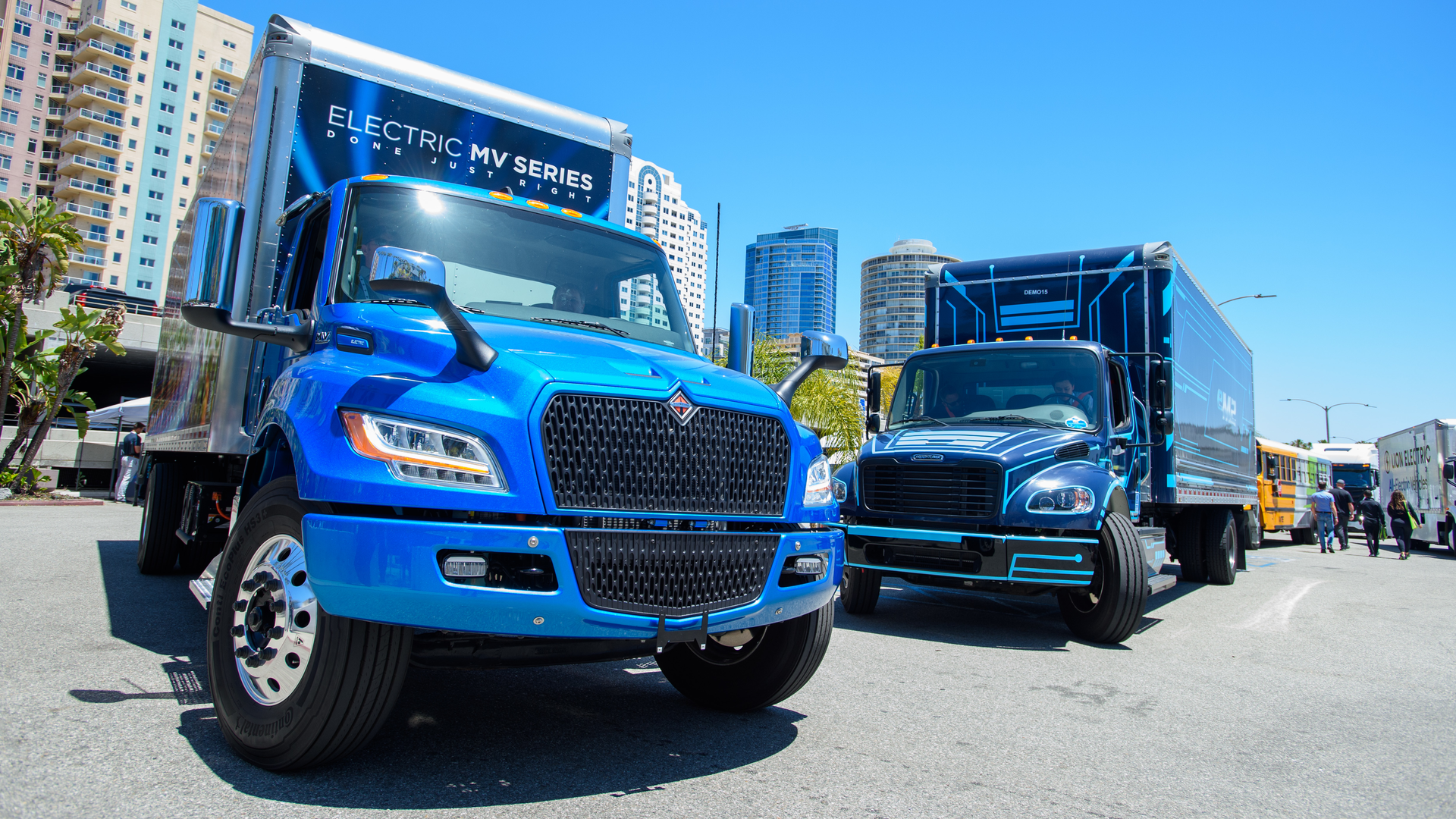 International&rsquo;s eMV, left, and Freightliner&rsquo;s eM2, battery-electric medium-duty trucks on display at ACT Expo 2022 in Long Beach, California.