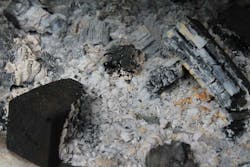 Figure 3- This image represents the aftermath of a clean burn, with the white/grey representing ash, and the black wood chunks representing leftover fuel particulate. Figure 3- This image represents the aftermath of a clean burn, with the white/grey representing ash, and the black wood chunks representing leftover fuel particulate.