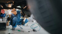 Technician Working on Brakes from Getty Images total cost of repair Technician Working on Brakes from Getty Images total cost of repair