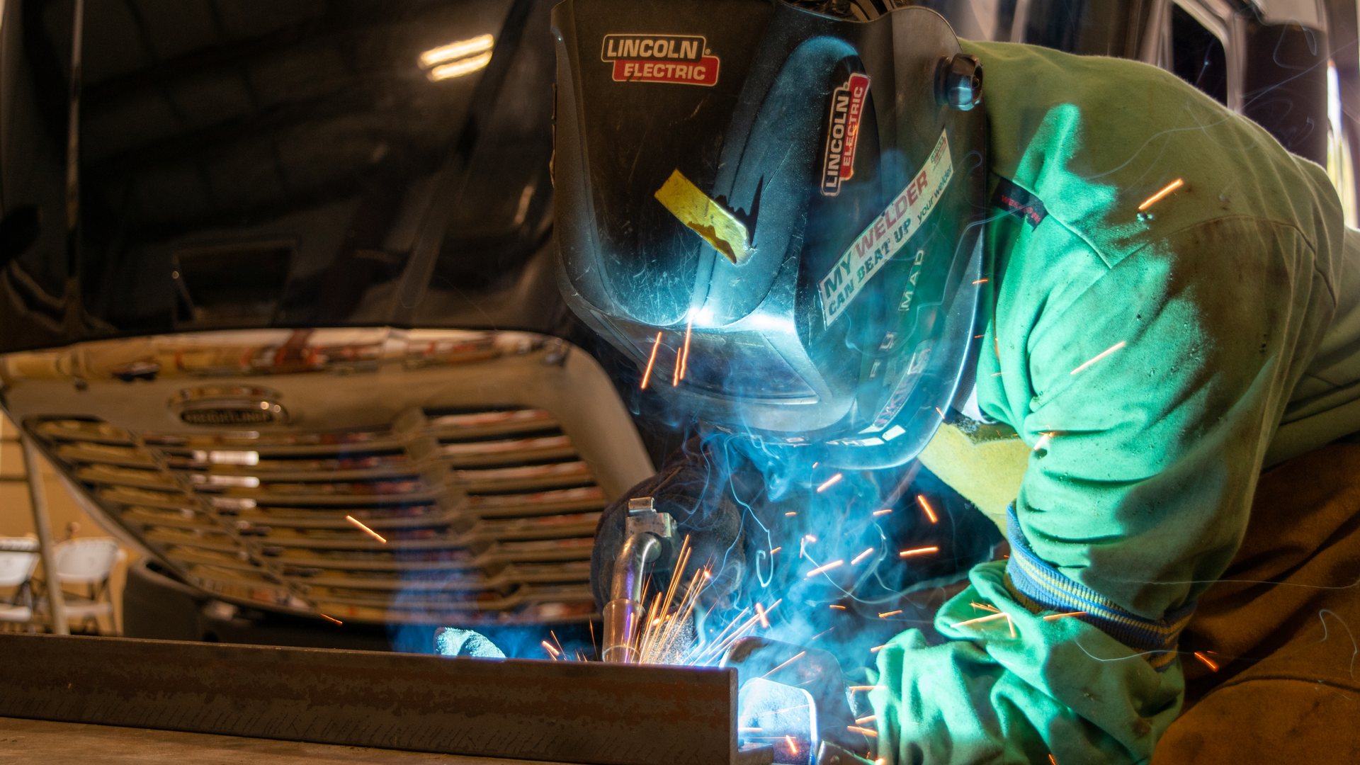 Fleet Fast technician Cristian Fonseca welds a liftgate.