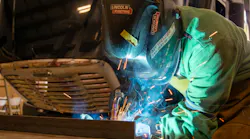 Fleet Fast technician Cristian Fonseca welds a liftgate.