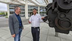 Jim Nebergall (left) and Puneet Jhawar of Cummins outside the corporate headquarters in Columbus, Indiana.