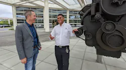 Jim Nebergall (left) and Puneet Jhawar of Cummins outside the corporate headquarters in Columbus, Indiana.