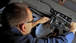 A technician installing the Bendix SmarTire solution. A technician installing the Bendix SmarTire solution.