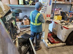 A technician in the ground maintenance department at Hawaiian Airlines prepares to lift a small pushback tug with a Stertil-Koni Mobile Column Lift. A technician in the ground maintenance department at Hawaiian Airlines prepares to lift a small pushback tug with a Stertil-Koni Mobile Column Lift.