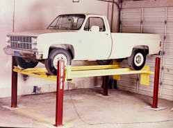 BendPak&rsquo;s first car lift, circa 1983. It was a fully mechanical lift with chains, sprockets, and a single large electric motor for the drive system. After selling about 200, the company discontinued this model in favor of simpler hydraulic/chain-driven designs.