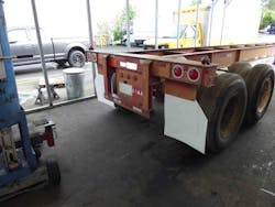 An image of the work area in first incident where a chassis crushed the technician against the blue steel bumper jack. An image of the work area in first incident where a chassis crushed the technician against the blue steel bumper jack.