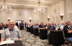 More than 100 attendees representing OEMs, dealers, and fleets, including Patrick Cooksey, fleet maintenance manager for MDI, at far right, listen as P.S.I. executives discuss the benefits of automatic tire inflation systems Nov. 10 in San Antonio.