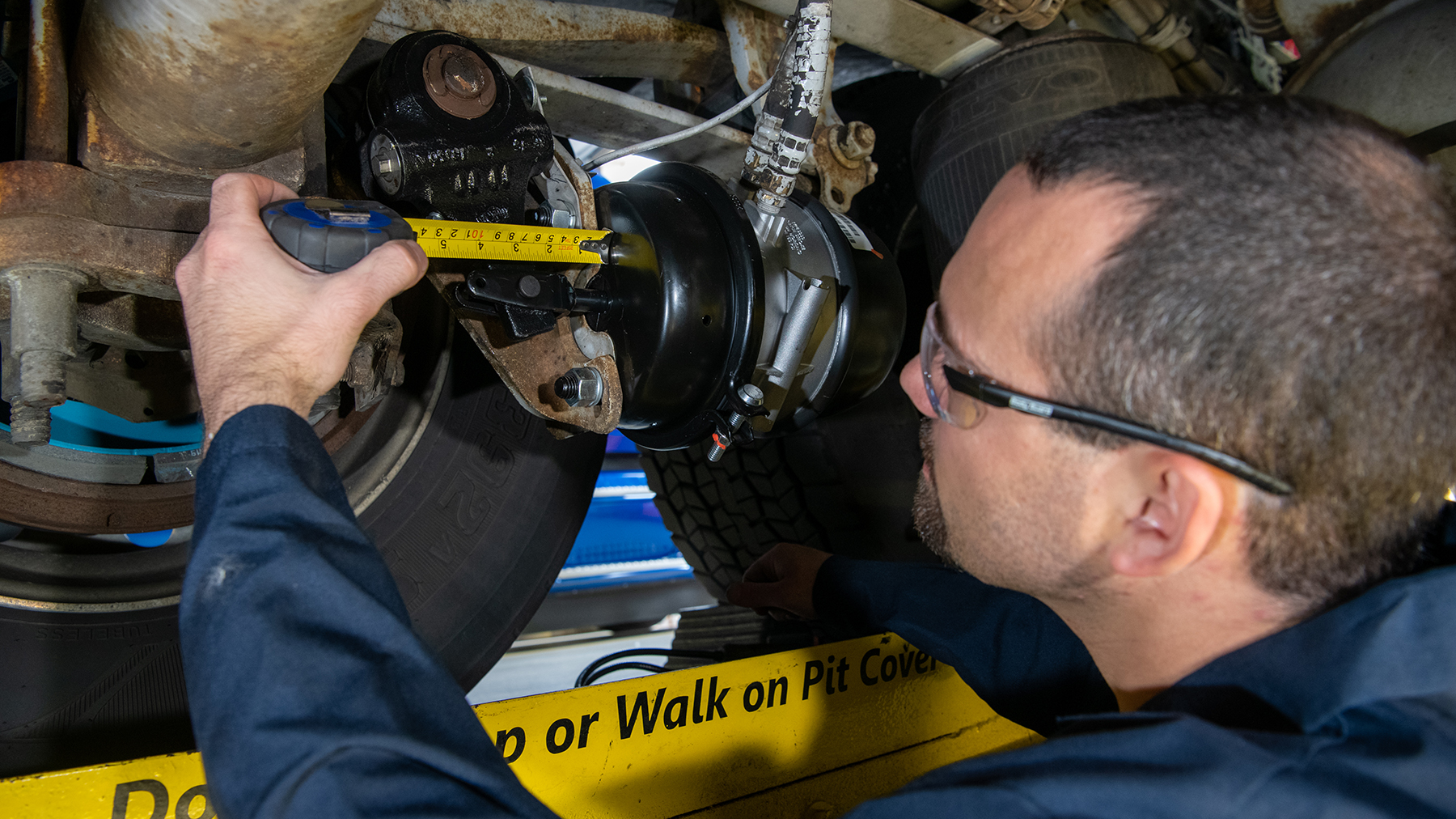 During roadside examinations, inspectors measure brake strokes at 90 to 100 psi of application pressure.