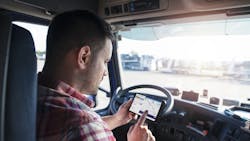A truck driver uses an Eleos Technologies app on a smartphone. Eleos creates custom mobile apps for trucking companies to tailor the work experience for their drivers. A truck driver uses an Eleos Technologies app on a smartphone. Eleos creates custom mobile apps for trucking companies to tailor the work experience for their drivers.