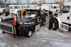A Vanair technician addresses battery issues in cold weather.