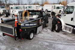 A Vanair technician addresses battery issues in cold weather. A Vanair technician addresses battery issues in cold weather.